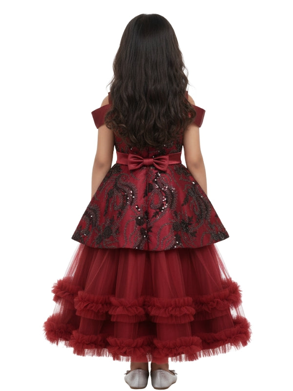 Red formal dress with black lace details on a white background