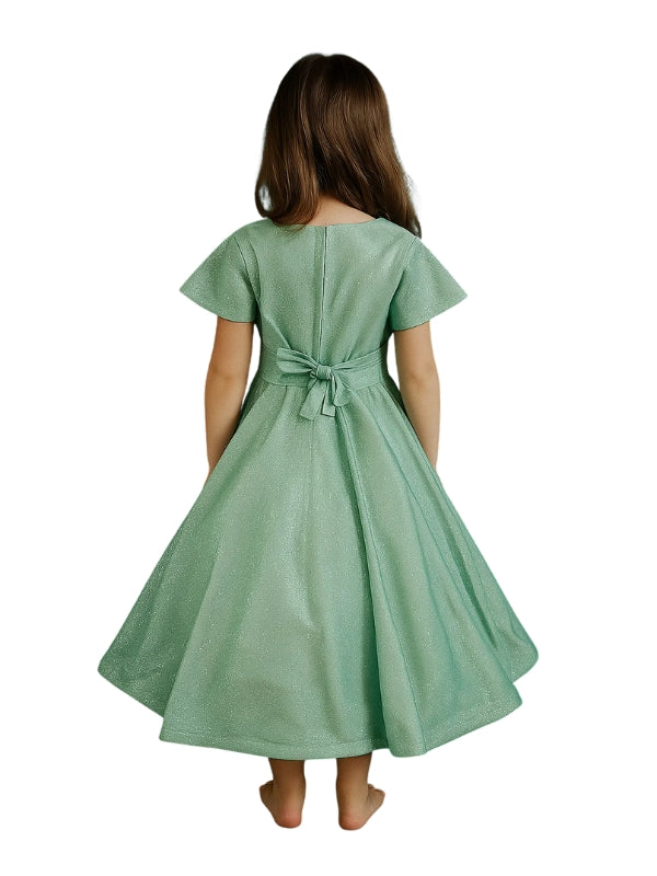 Green dress worn by a girl on a white background