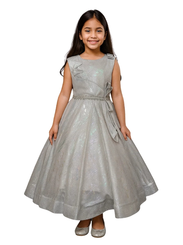 Young girl wearing a silver dress on a white background
