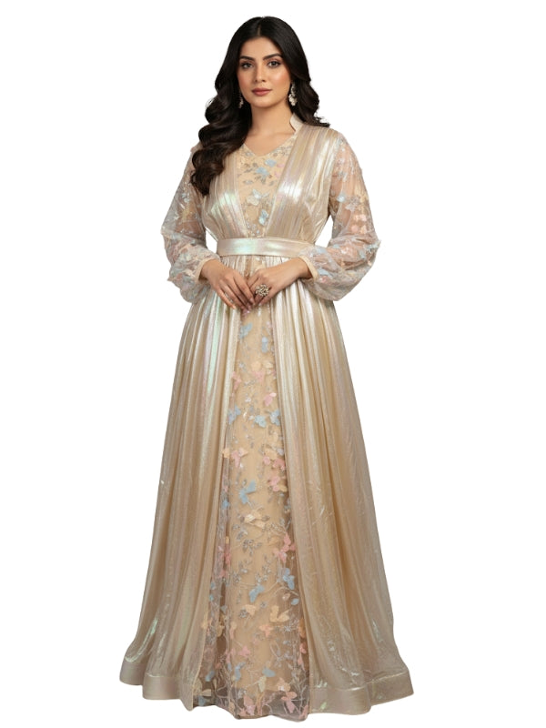 Woman wearing a beige floral embroidered dress on a white background