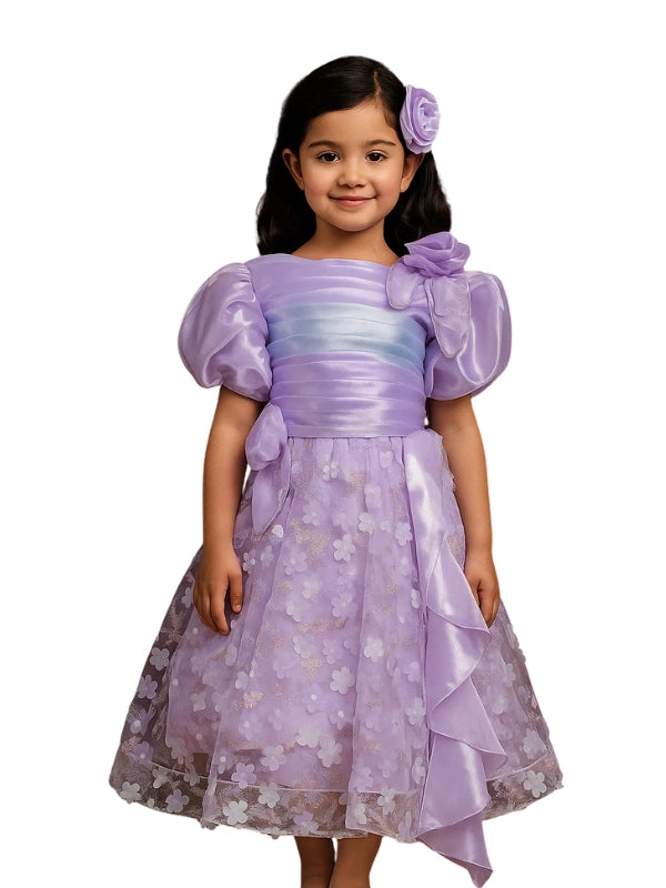 Young girl wearing a purple dress with floral patterns on a white background