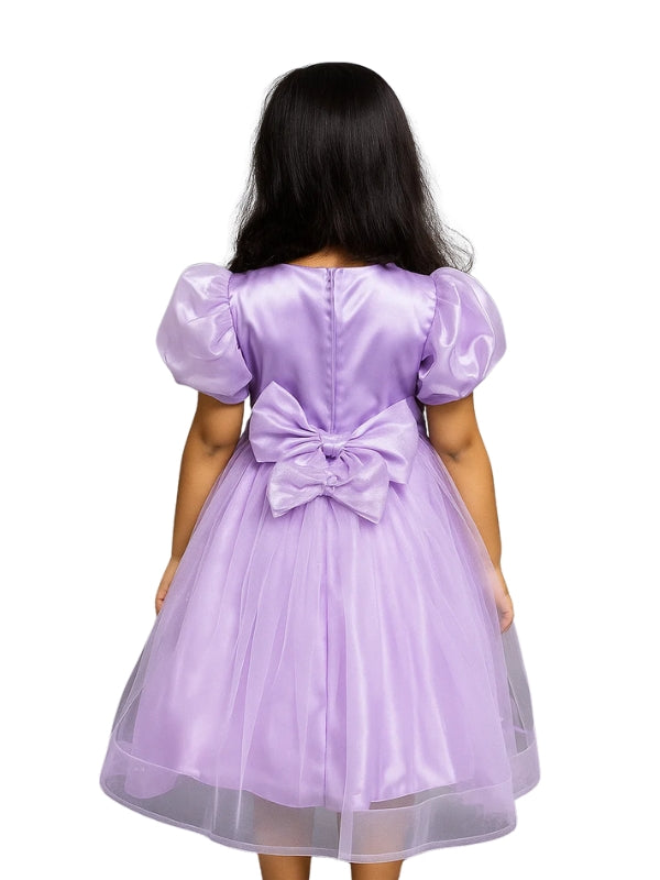 Lavender dress with a large bow on the back, worn by a person.
