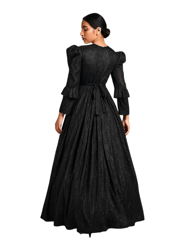 Woman wearing a black vintage-style dress with ruffled sleeves on a white background