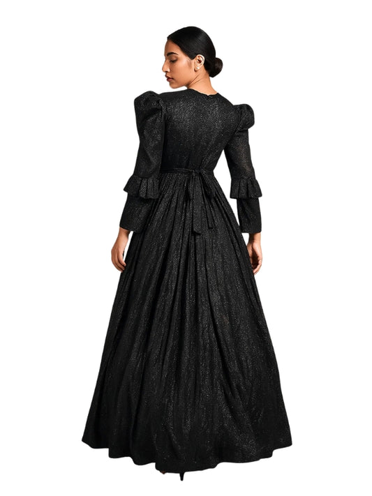 Woman wearing a black vintage-style dress with ruffled sleeves on a white background