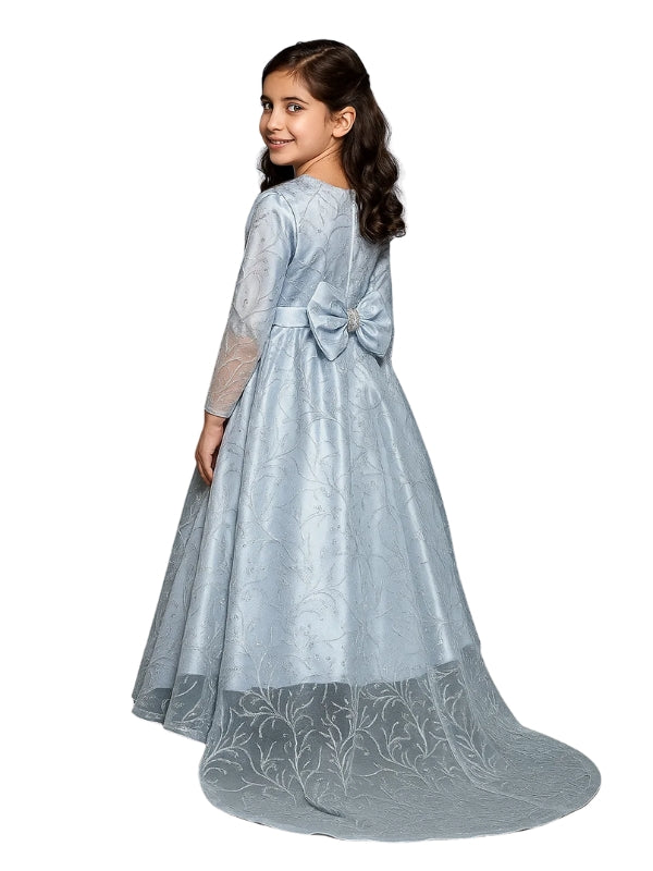 Girl wearing a light blue formal gown with a bow on a white background