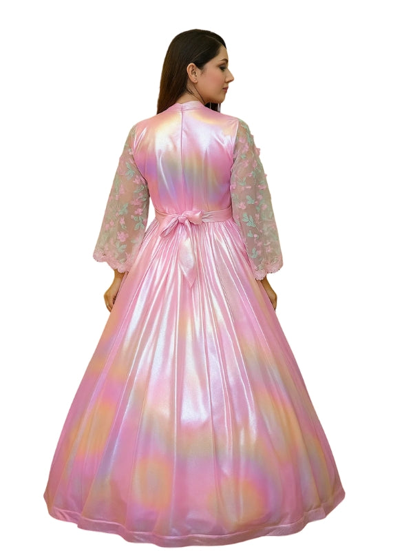 Woman wearing a long, colorful dress with a white background