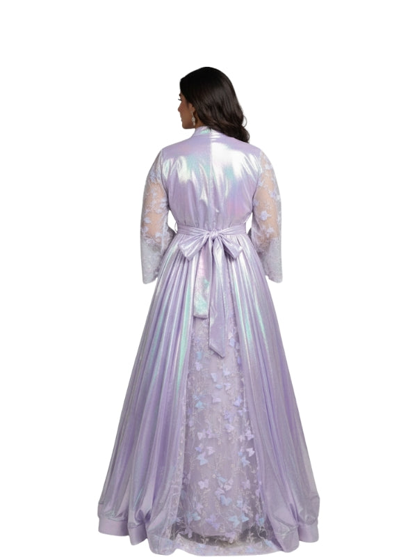 Woman wearing a long, light purple dress with floral patterns on a white background