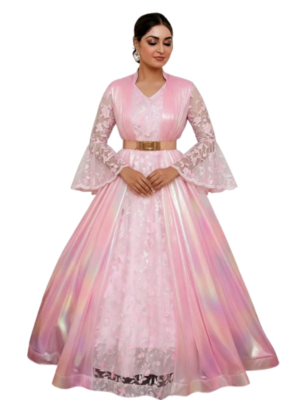 Woman wearing a pink and white embroidered dress on a white background