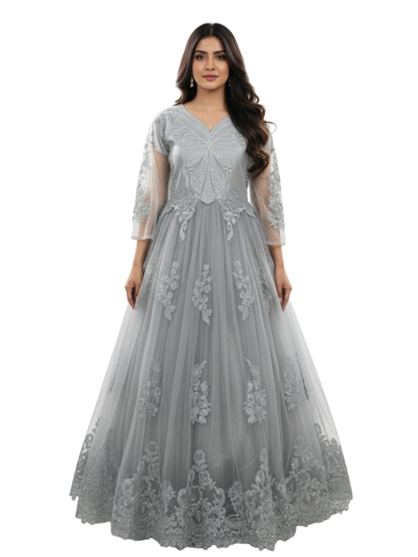 Woman wearing a gray lace evening gown on a white background